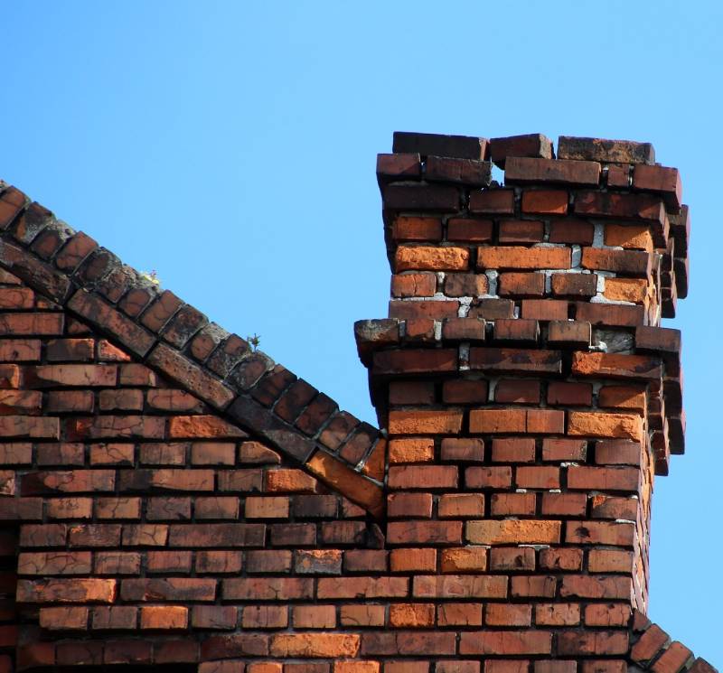 Signs Your Chesterfield Home Needs a Chimney Inspection Damaged chimney on an Chesterfield home showing cracks and missing mortar